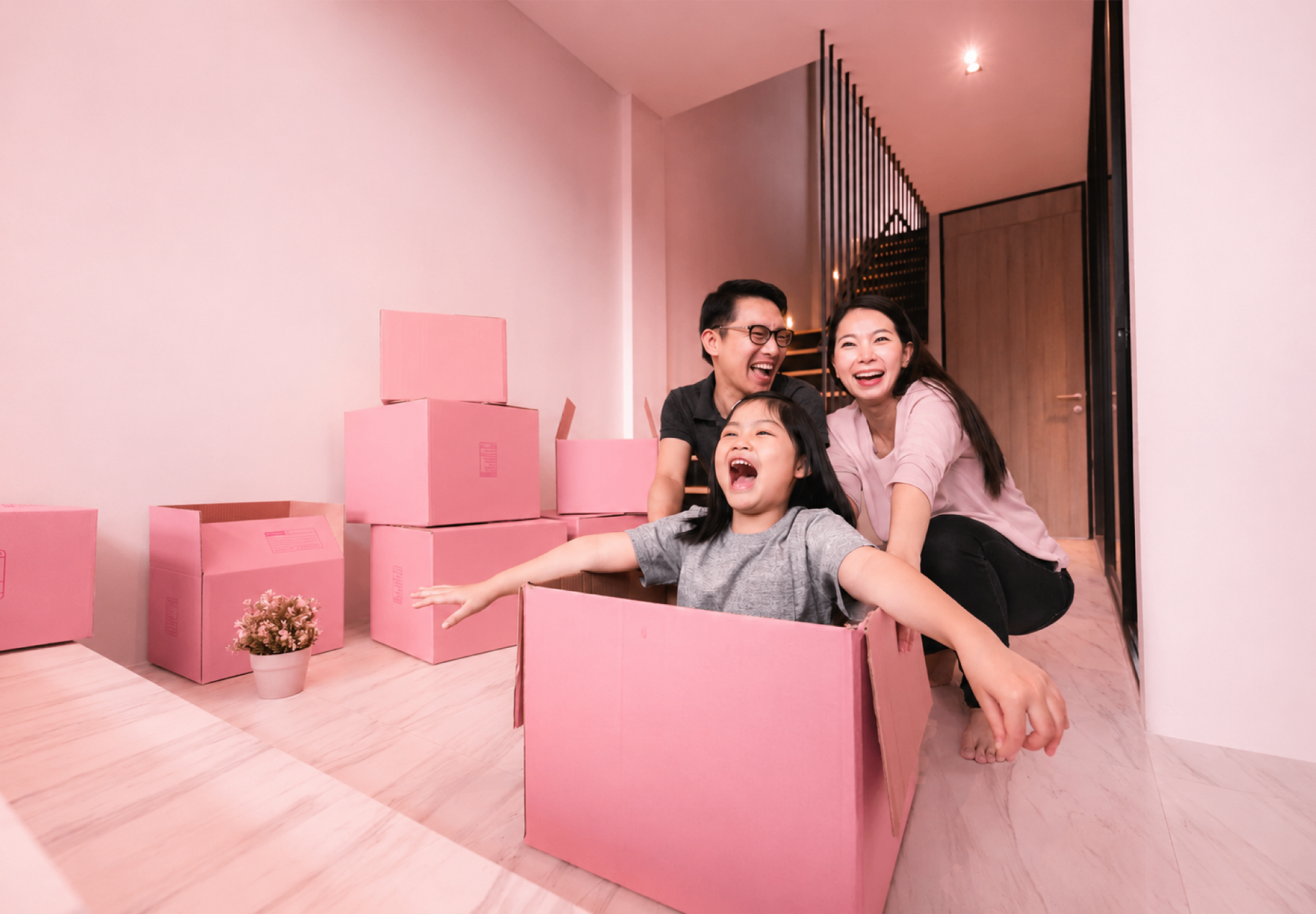 Happy family with moving boxes
